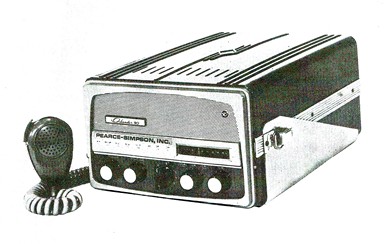 Radio transceiver with 5 knobs on front and microphone off to the right